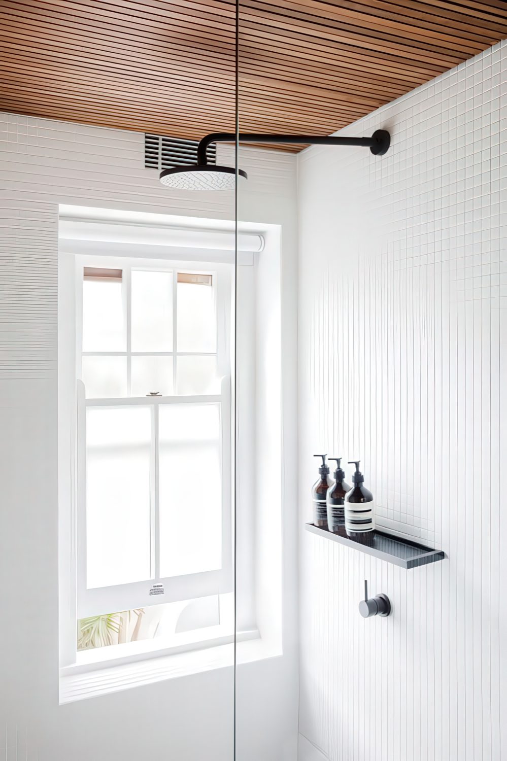 A pull-down blind provides privacy without blocking out too much light from the window.