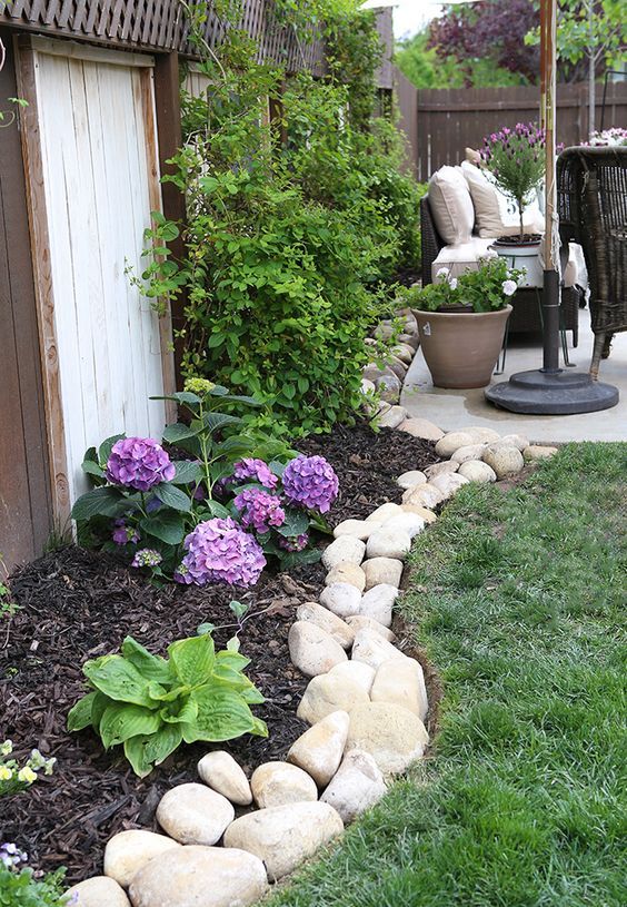 A river rock border brings a natural feel to the garden - the rocks show off different sizes and shapes.