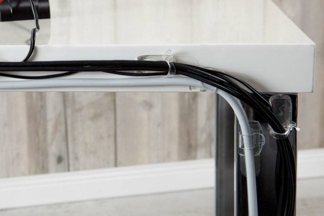 Hook cords to the back of your furniture using cord clips you can buy anywhere, this is a great idea not only for a TV.