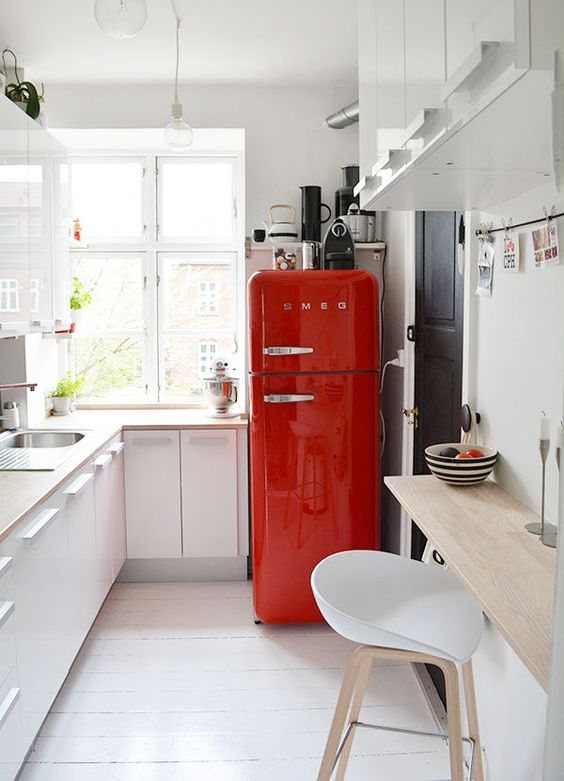 Spruce up a neutral space with a bright red fridge from SMEG, such a fun idea.
