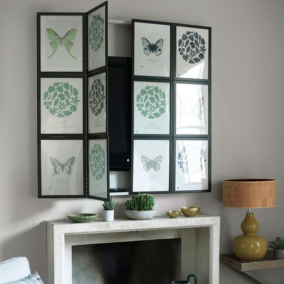 A modern fireplace with potted greenery and a TV over it that can be hidden with a bi-fold botanical panels is a cool and fresh idea.