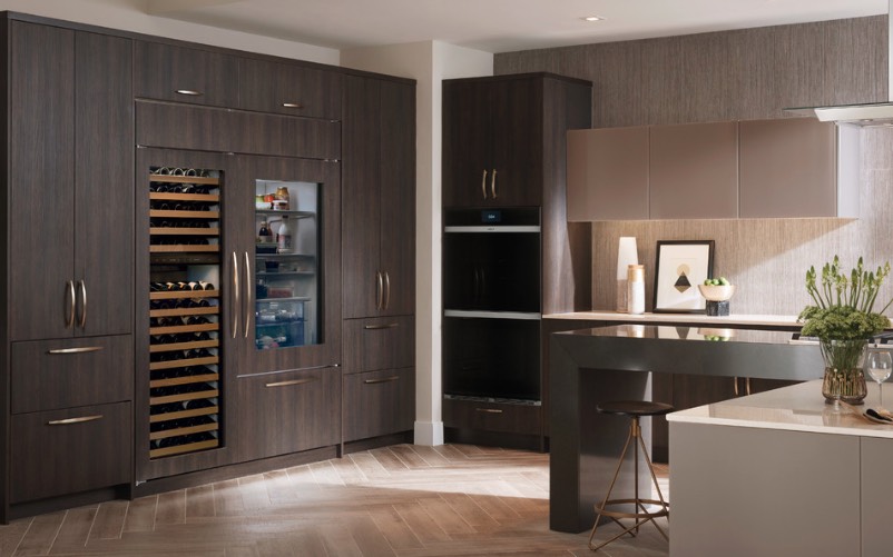 Integrate your fridge and wine cooler into your wooden cabinets to keep the kitchen more unified and sleek.