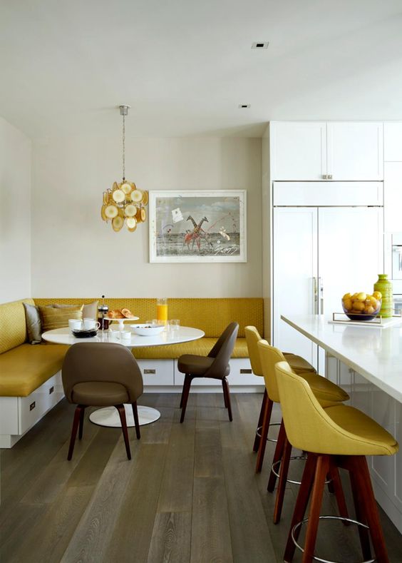 If there's enough space, go for two eat-in spaces, one on the kitchen island and one in the corner and make them echo.