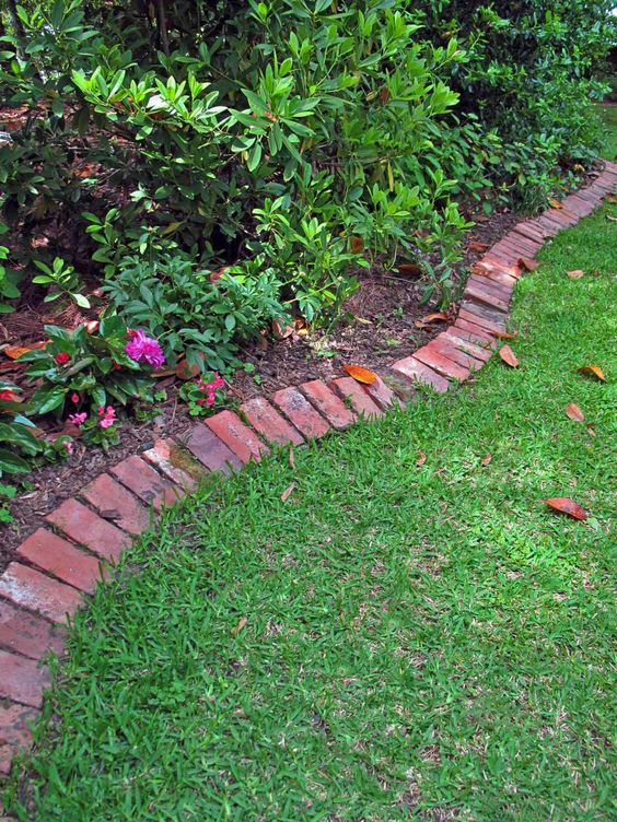 Red brick edging is a stylish idea that fits most of outdoor landscaping styles and a touch of color.