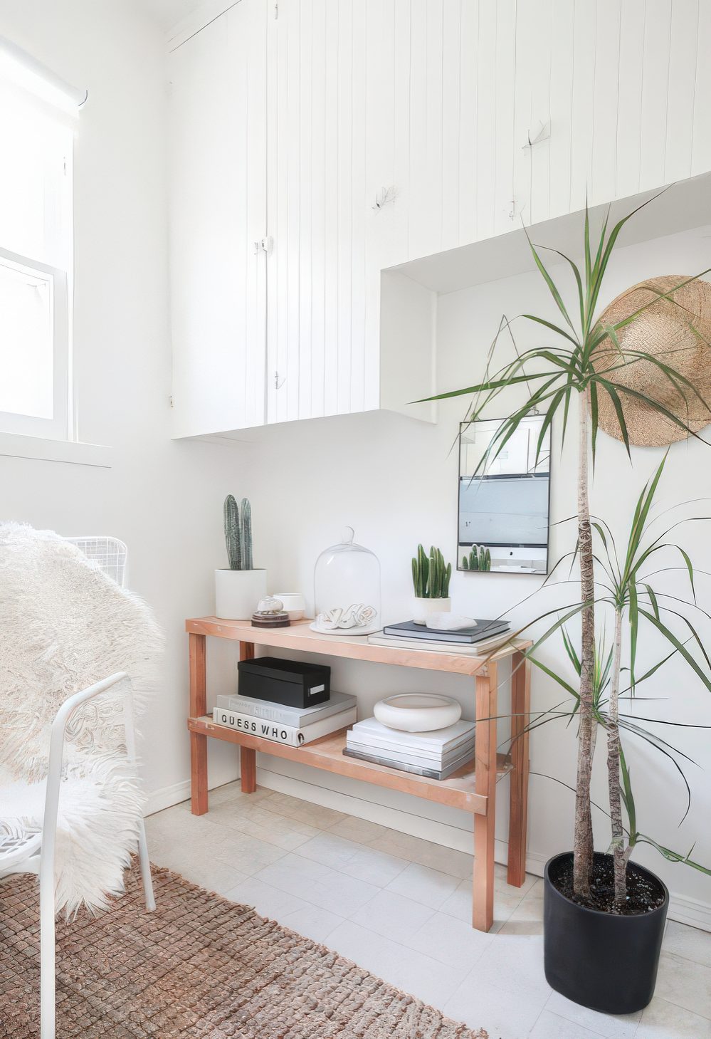 A narrow console table is a great idea for storage in an awkward nook, it fits perfectly.