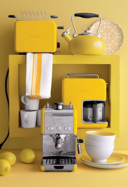A set of sunny yellow kitchen appliances with a stainless steel touch for a sunny mood.