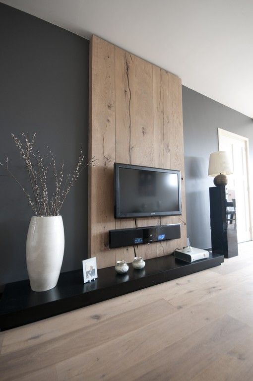 Build a faux wall of timber that matches your decor, accents the TV and hides all the cords you won't want to see.