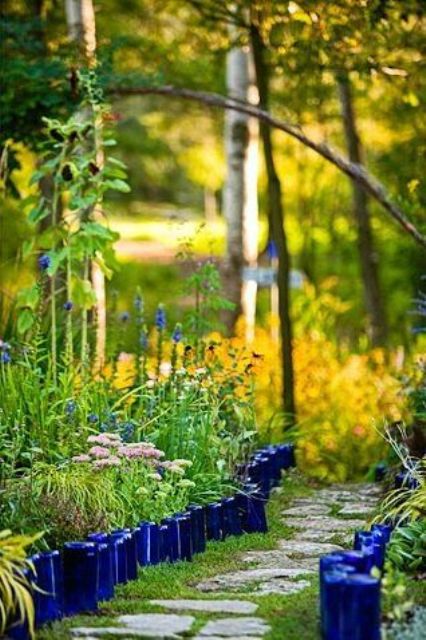 Bright blue bottle garden edging will bring much color and a relaxed rustic feel to your garden.