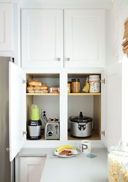 A cabinet with appliances and various stuff for making sandwiches is a cool idea for making breakfasts here.
