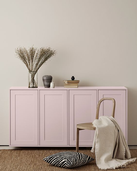 A light pink IKEA Metod sideboard with shaker doors, with stylish decor for a Scandinavian space.