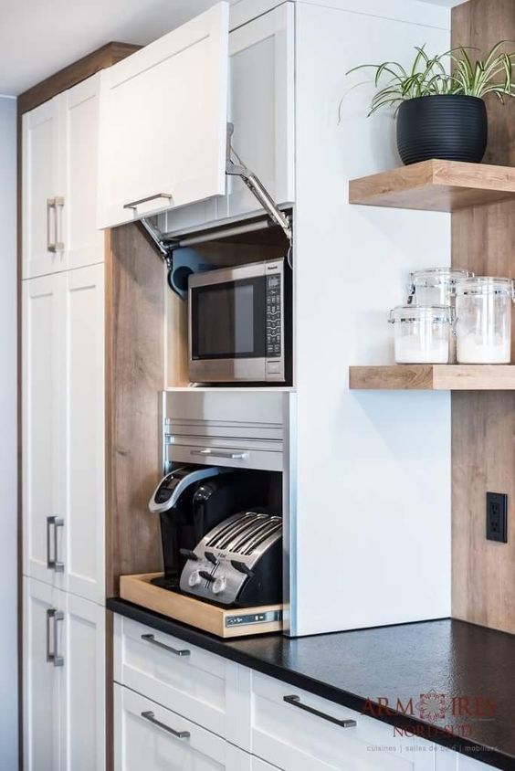A stylish cabinet with sliding doors is a cool holder for various appliances and you may use them right here without taking them out.