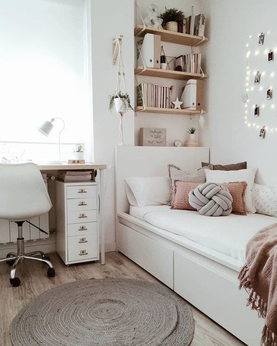 Create a stylish modern teen girl bedroom in neutrals with dusty pink touches. Lights, a jute rug, and potted greenery bring warmth and style. This design combines elegance with a modern touch.