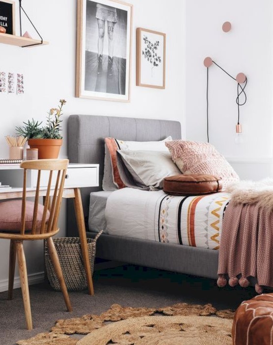 Create a stylish modern teen room with an upholstered bed and a white desk. A wooden chair, gallery wall, and cool hooks complete the design. This room combines modern aesthetics with functional features.
