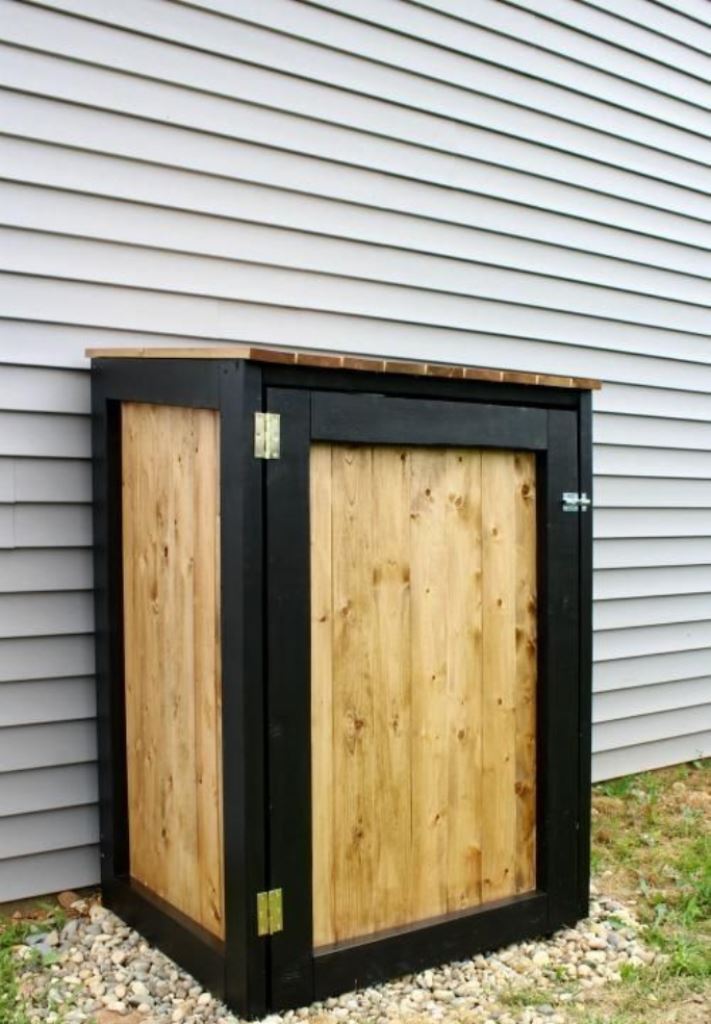 This stained and black wooden box is for hiding just one trash can and you can DIY it. 

(via learn).