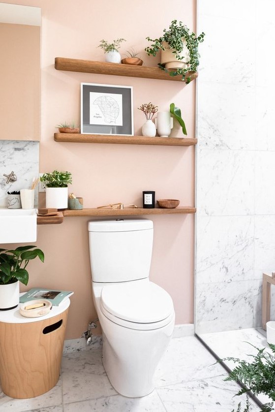 Blush walls paired with white marble tiles and light-stained wood look cool and very tender at the same time.