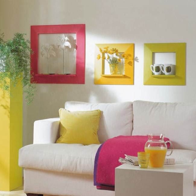 Bold textiles, a sunny yellow plant stand and colorful frames enliven the living room making it feel summer-like.