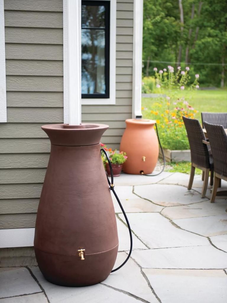 These modern containers with gold faucets are a nice match for the space, and you can top them with blooms.