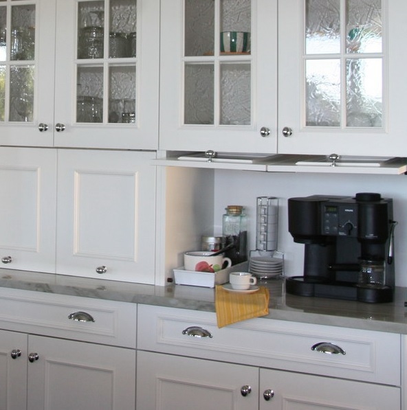 A mini coffee station with a coffee machine, cups and mugs and sugar hidden in a rustic cabinet is an elegant option.