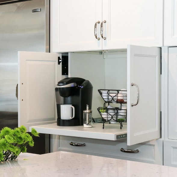 A small cabinet with a retracting shelf hides a whole coffee station, which is very comfy and cool.