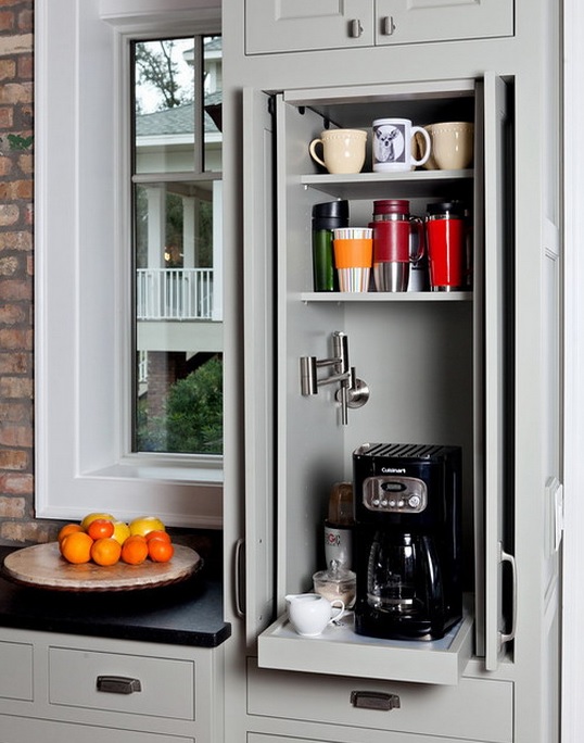 A small cabinet with shelves and a retracting one with a coffee machine is a lovely mini coffee station.