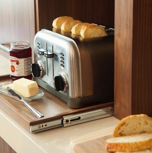 A retractable shelf with a toaster is a pretty idea for those who love toasts for breakfast.