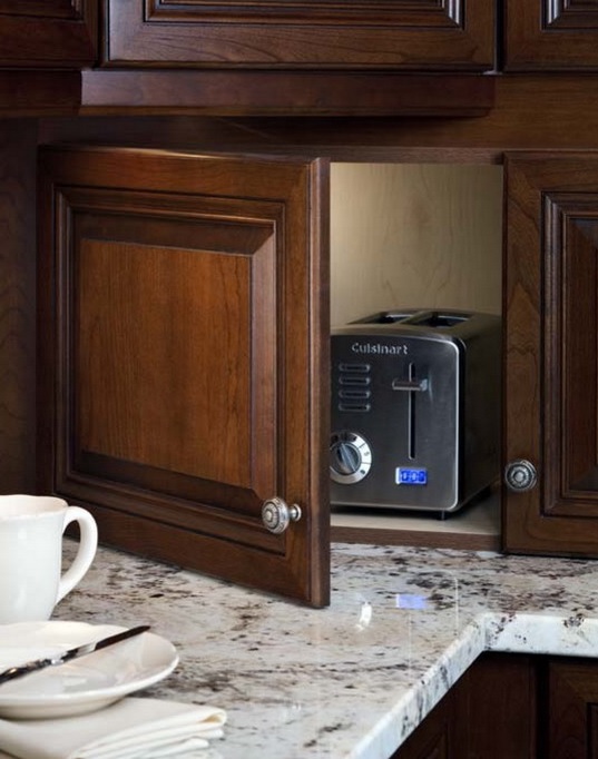 A dark stained cabinet with a toaster is a lovely idea if you use it only for breakfast and don't need in any other time.