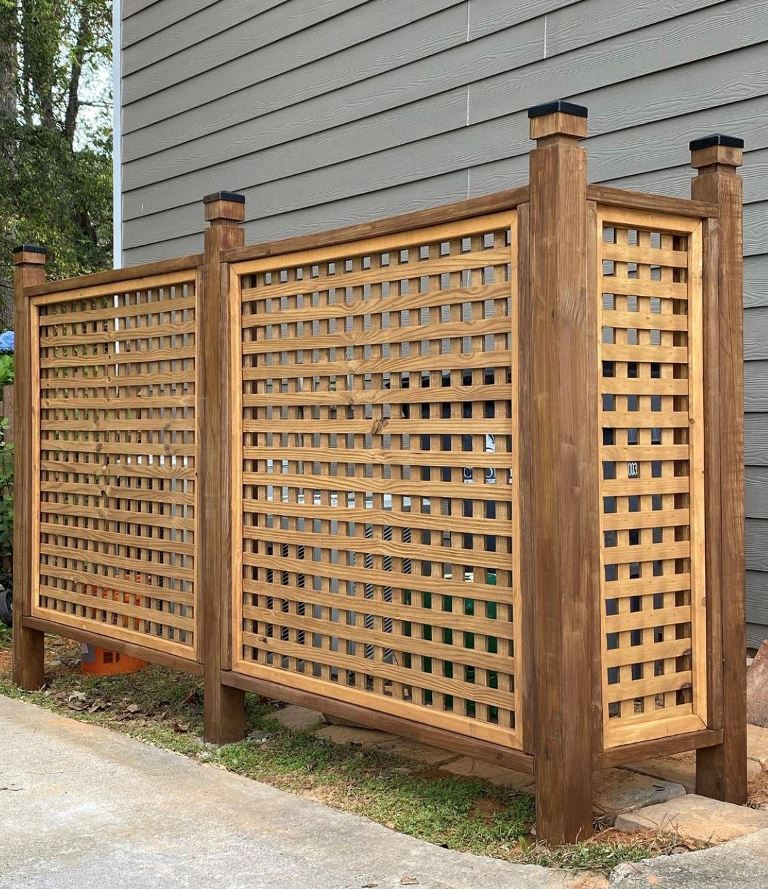 The AC unit is styled with latted screens in stained frames, and this is a pretty choice for a modern farmhouse space.