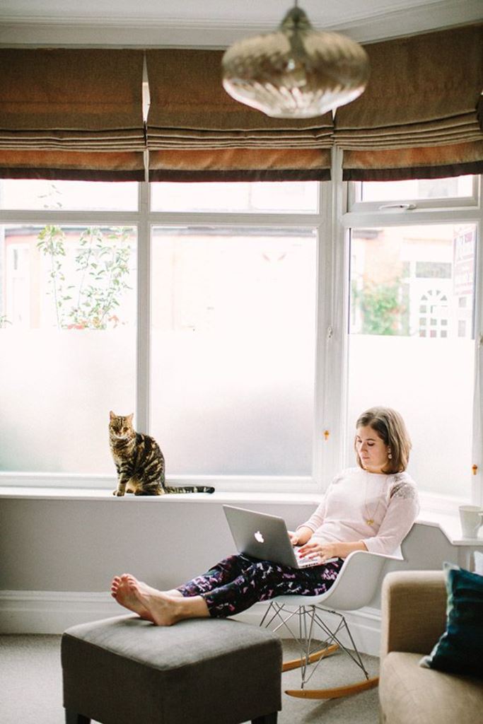 The large window is styled with film, differently on each pane, and it brings privacy and blocks the view.