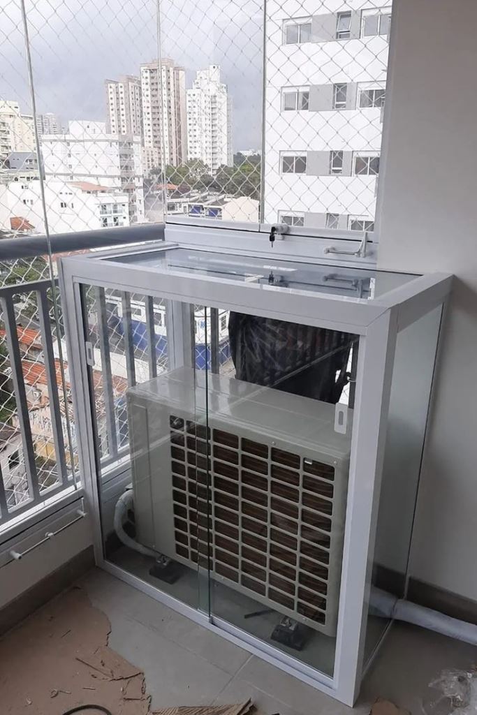 Glass boxes are a cool idea for AC units: they keep them all-safe and look nice. If it doesn't seem so, choose colored glass.