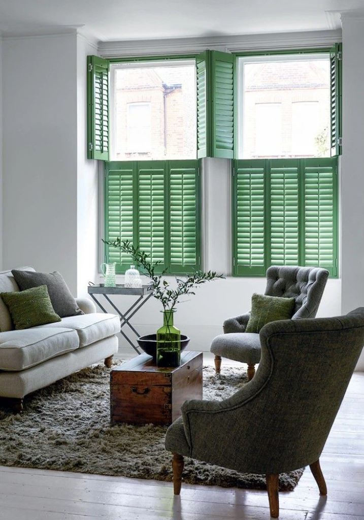Such modern green shutters will not only block the ugly view and let light in but will also add interest and color to the space.