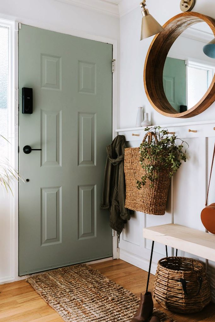 Entryways are often small, and here you should use every inch of space. Paneling can be finished off with hooks to hang some clothes and bags.