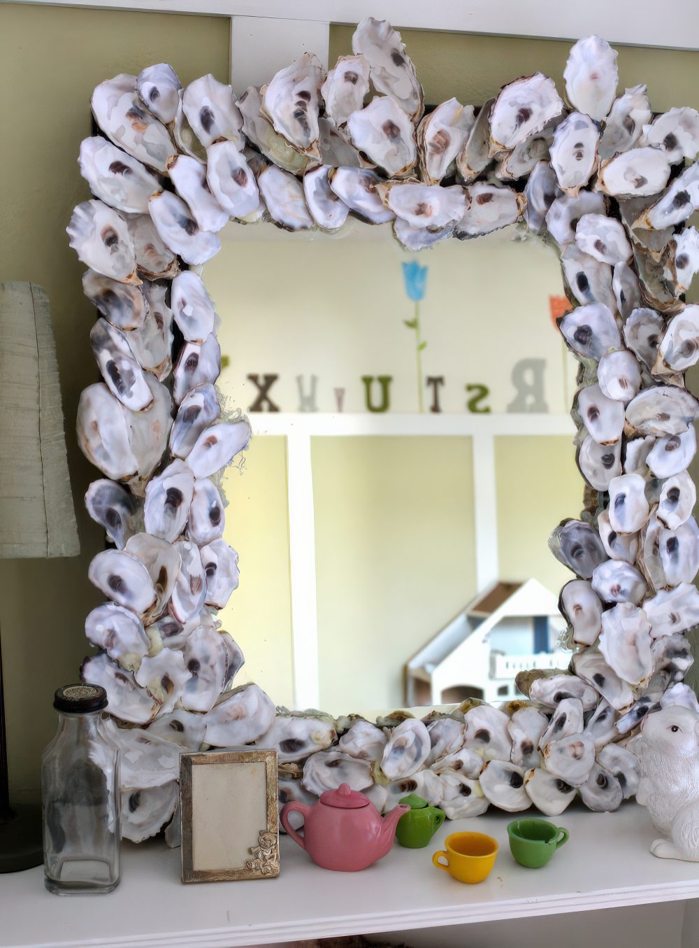 Cover a mirror frame with large seashells to make it feel beachy and decorate any space you want with it.