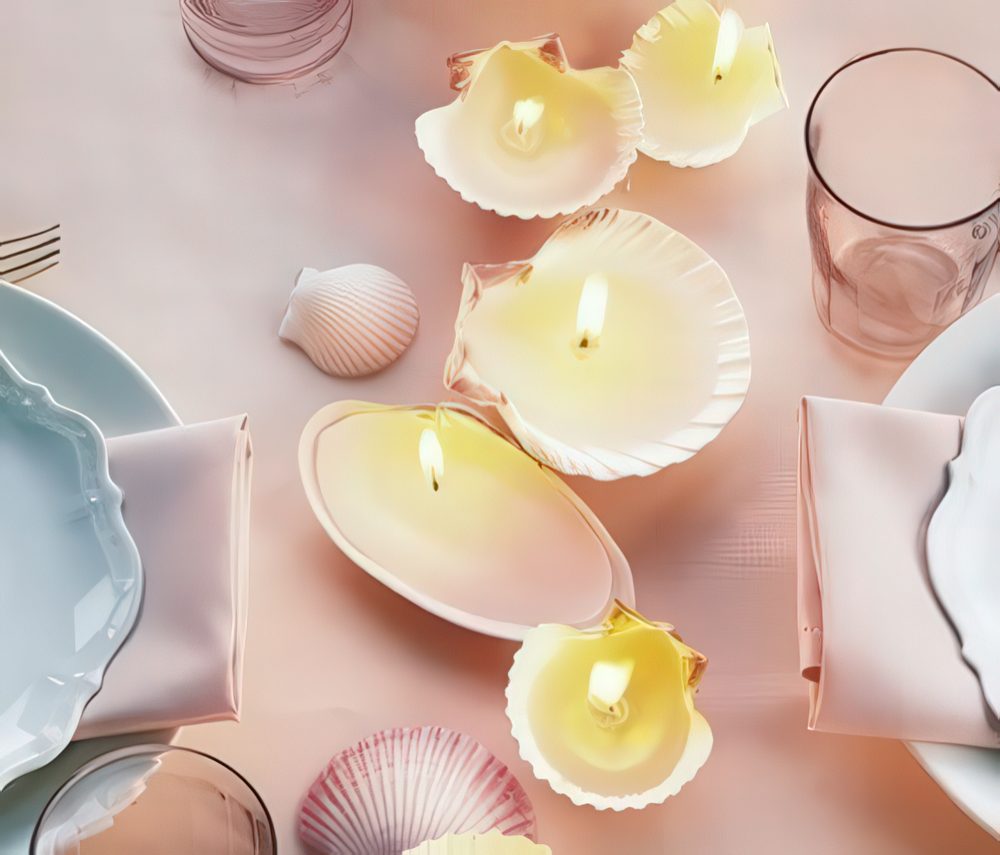 Seashell candles placed on the table make up a cool table runner with lights.