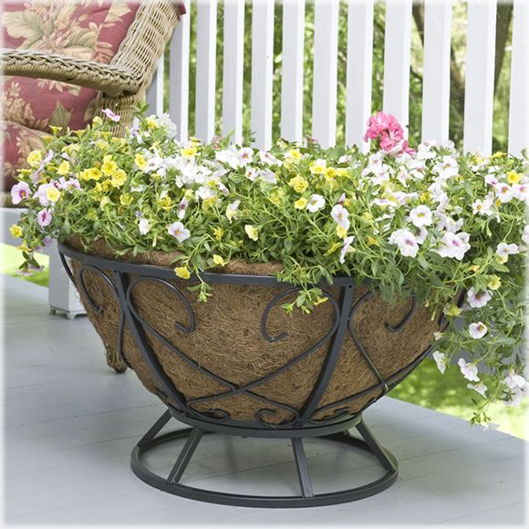 An oversized turf planter with lots of colorful blooms will make your outdoor space more elegant and summery.