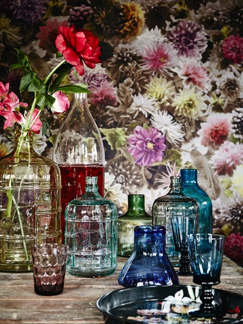 Colorful vintage bottles and vases with some bold peonies in them will give you bright summer-like decor and a bold touch.
