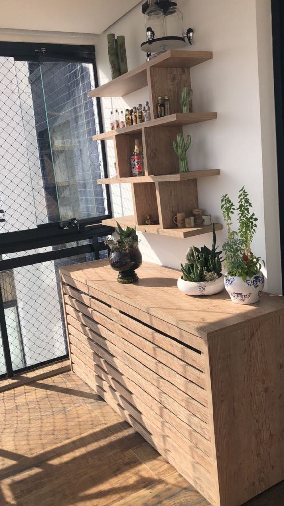 The stained cabinet conceals an AC unit and there's a shelving unit over it as a match.