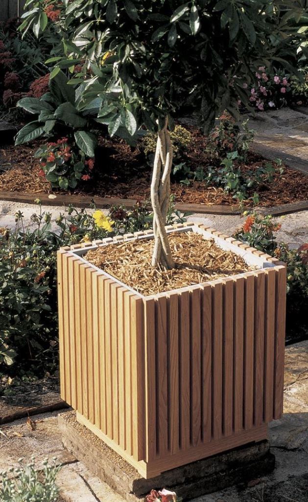 This tall slatted planter for a single tree is an ultimately chic solution for a contemporary yard.