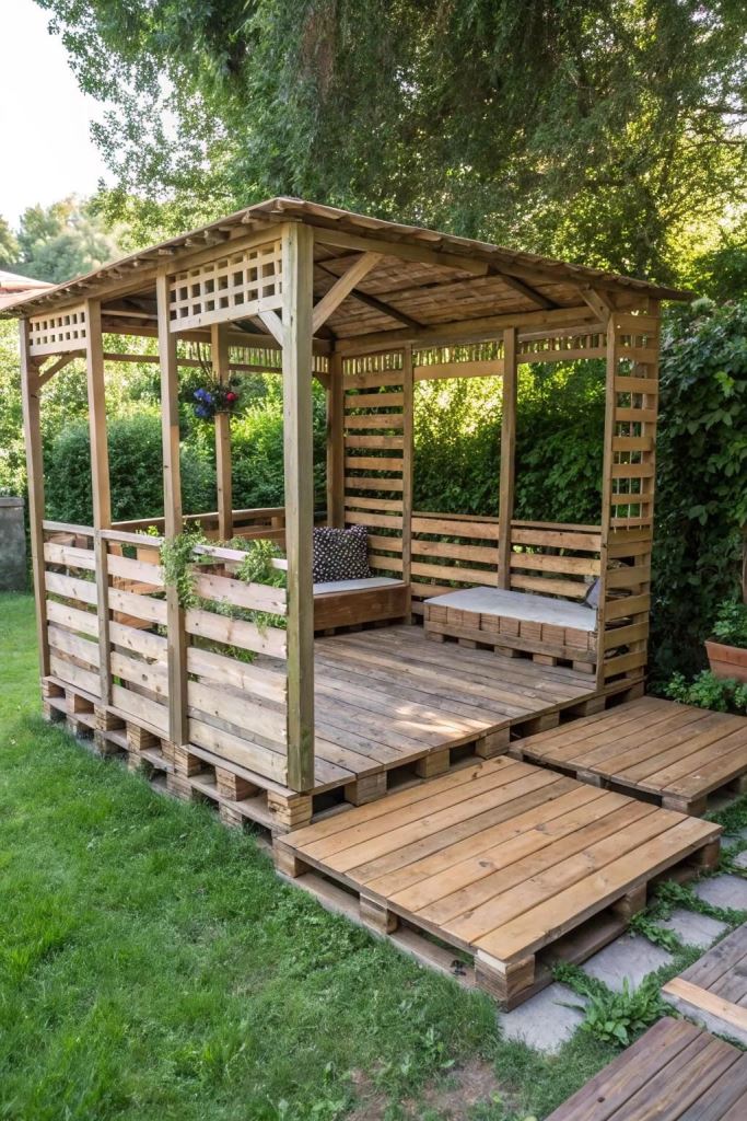 The pallet pergola includes a couple of daybeds, and its solid roof will protect the owners from rain. 

(via garden).