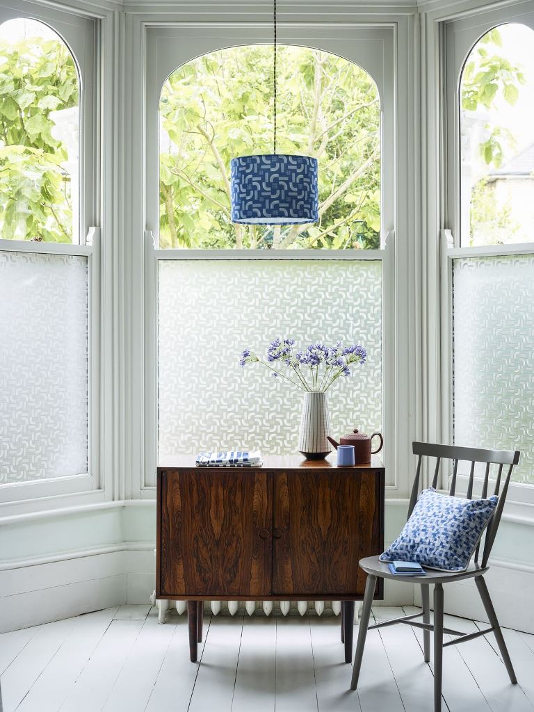 The bow arched window is styled with printed film to make the nook private and enjoy light.