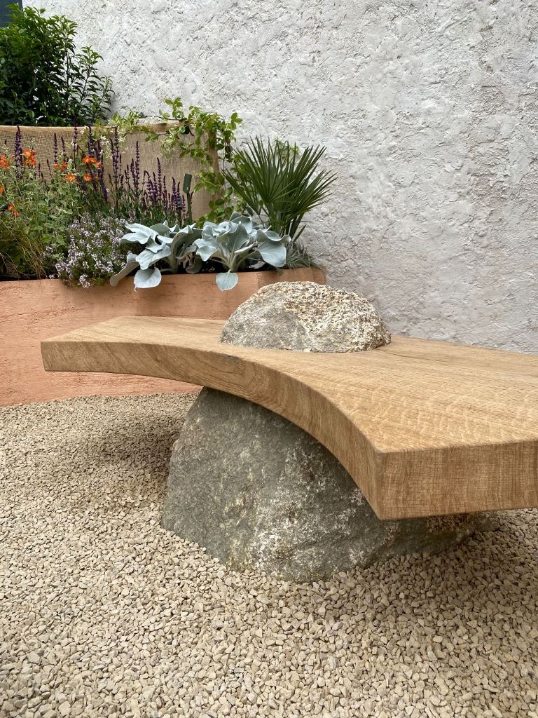 This unique sculptural bench features a large rock and a curved wooden seat, a gorgeous wabi sabi solution. 


(via studioterraforma).