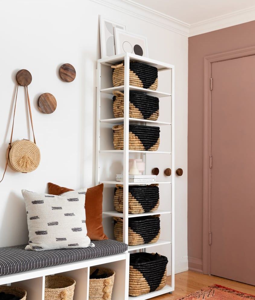 A simple tall shelving unit done with baskets will make up a cool storage piece with an eye-catchy detail.