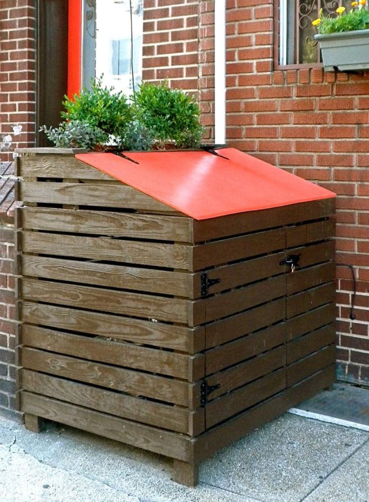 This stained slatted box features a red lid that looks bold and catchy.