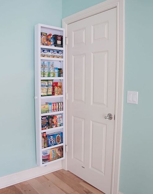 This tall and narrow storage piece is a nice spice rack behind the door.
