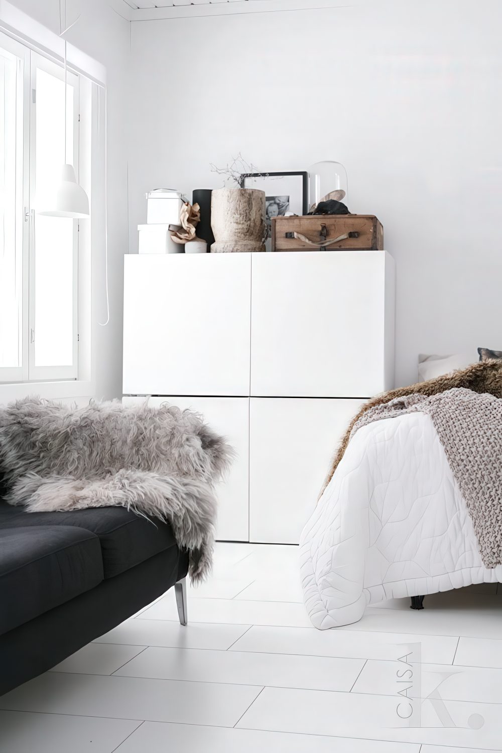 Stacked IKEA Besta units in a bedroom.