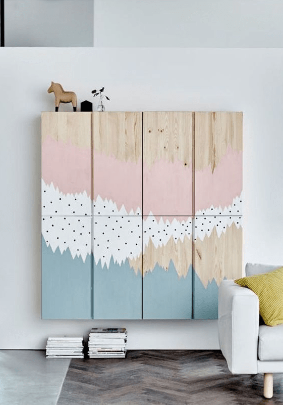 A nursery storage unit created of Metod cabinets and some artful painting is a beautiful idea.