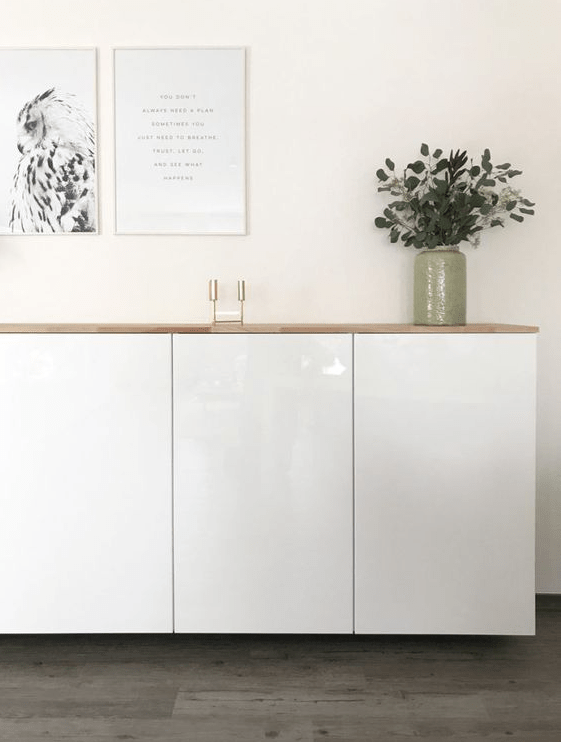 A stylish floating sideboard made of IKEA Metod cabinets and a light-colored wooden tabletop.