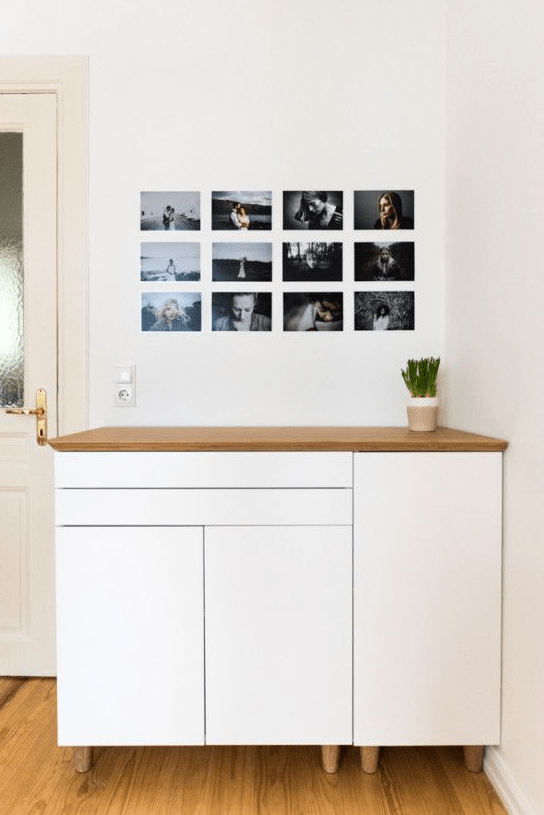 An IKEA Metod cabinet spruced up with wooden legs and a wooden tabletop to turn it into a chic buffet.